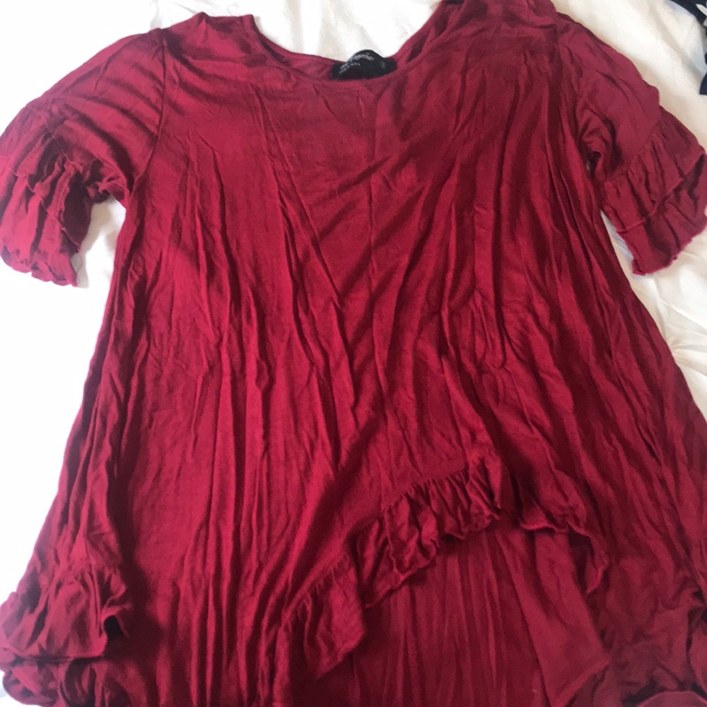 Red blouse with ruffled sleeves and bottom